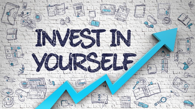 The words "invest in yourself" with an upwards arrow