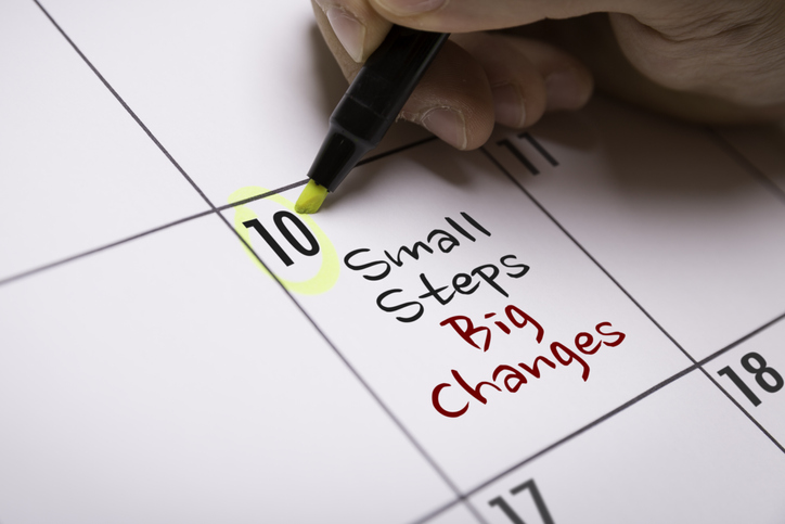Photo of a calendar with "small steps big changes" written in one date box