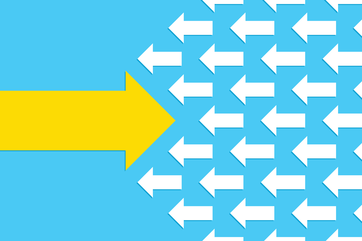 A light blue background with a large yellow arrow pointing to the right, going against several small white arrows pointing to the left