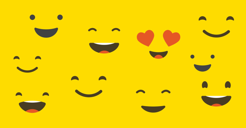 A yellow background with several different smiling face emojis