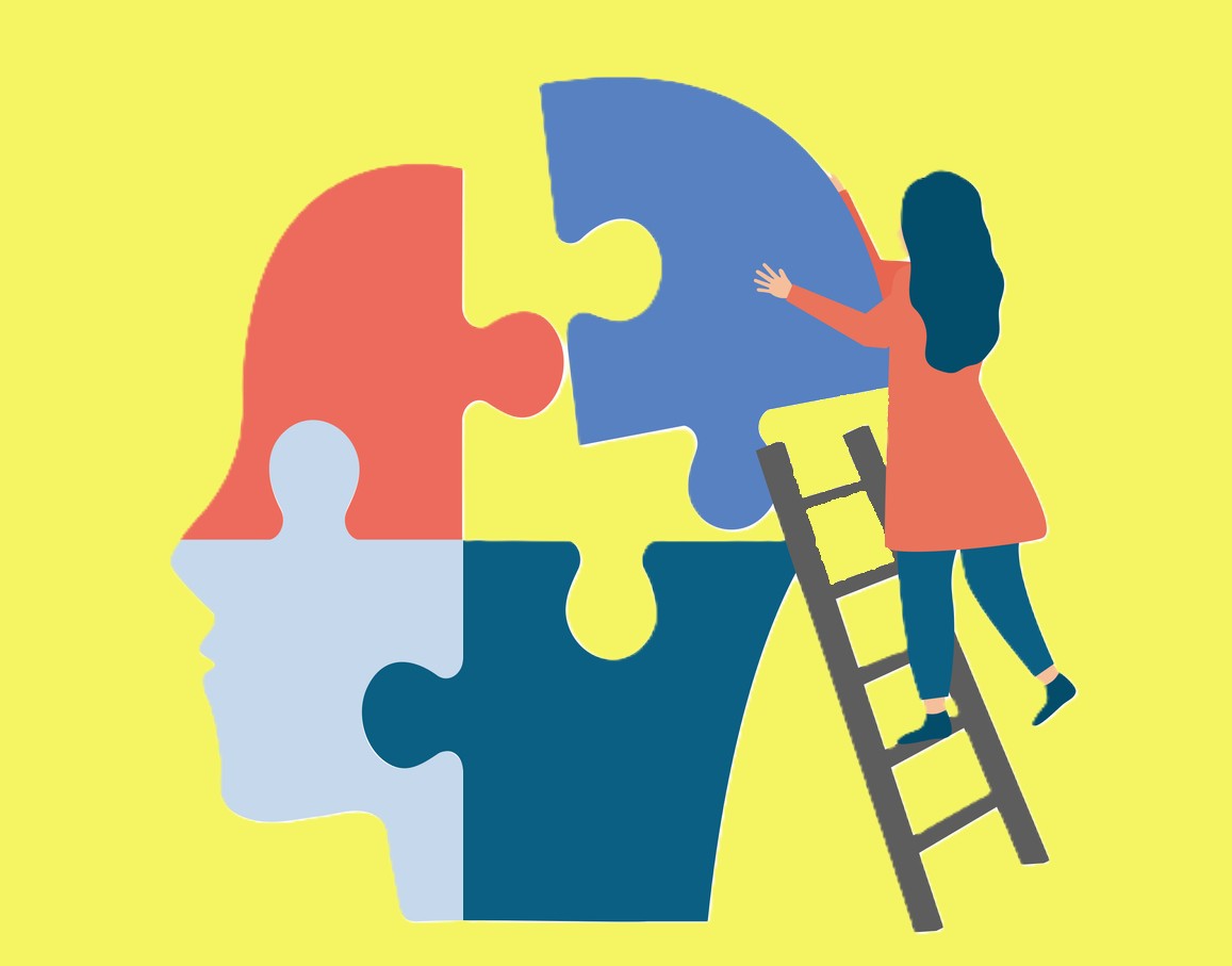 A stylized illustration of a person on a ladder placing a puzzle piece into a large head-shaped puzzle