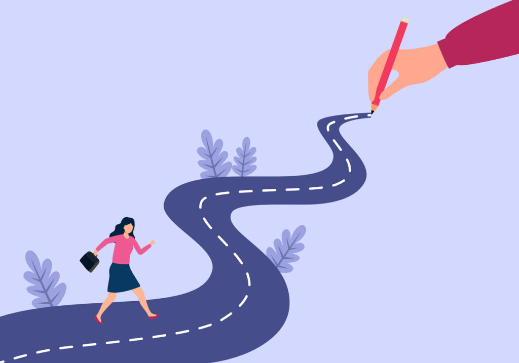 A stylized illustration of a businesswoman walking along a winding road while a giant hand draws the road ahead with a pencil, symbolizing goal-setting, planning, or shaping one's future journey.