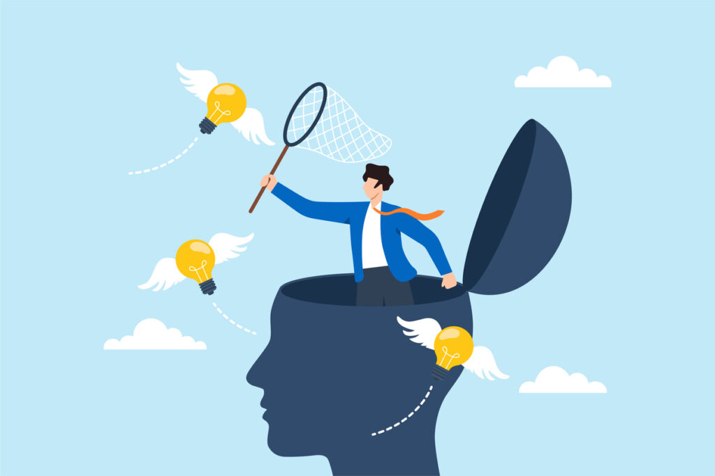 Flat illustration of a businessman inside an open head using a net to catch flying lightbulbs with wings